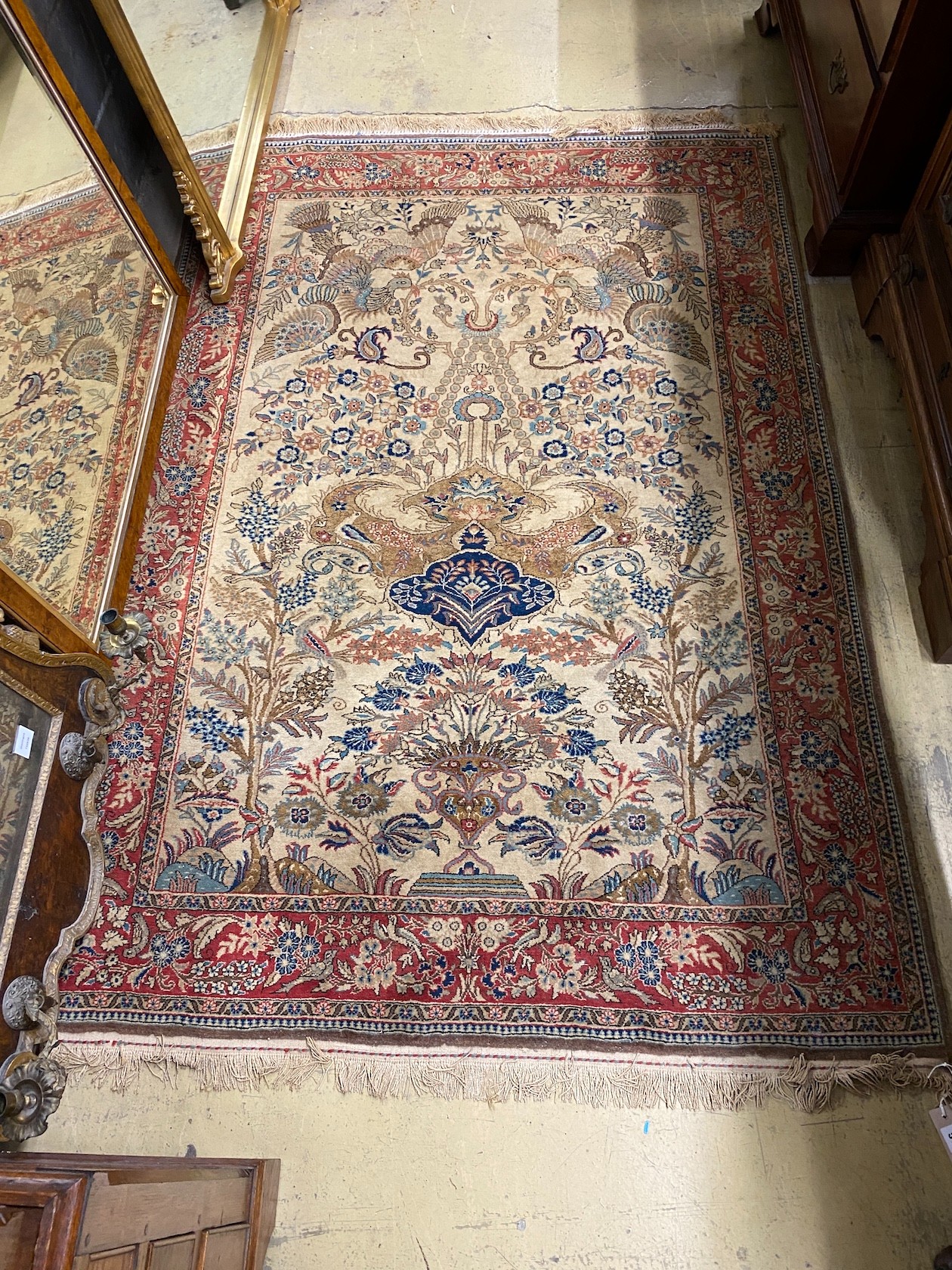 A North West Persian cream ground carpet, bird design, 204 x 136cm